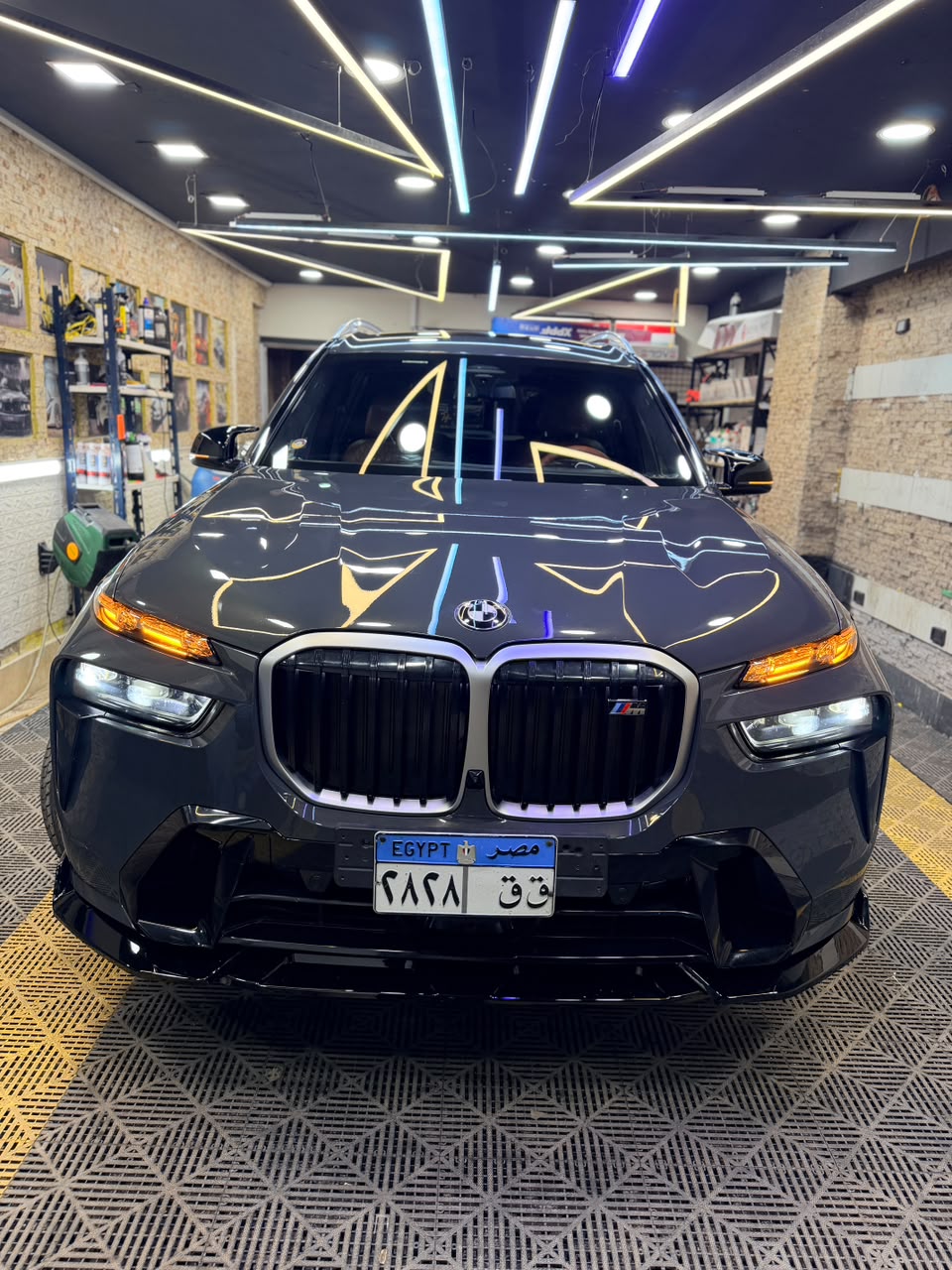 Black BMW X7 M Sport photographed head-on inside the ShieldPlusEGY studio