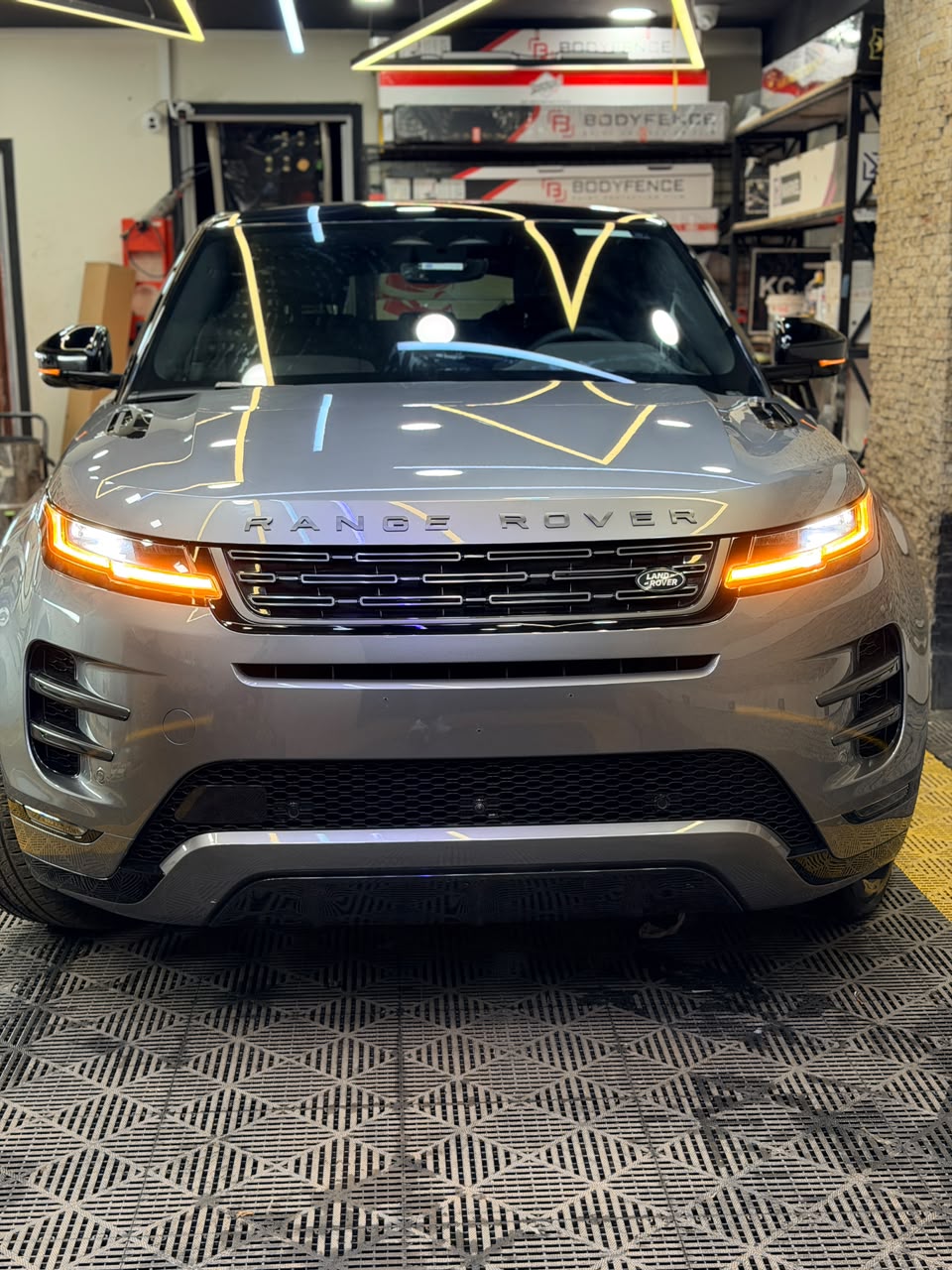 Bronze SUV front quarter, showing the headlight, wheel arch and alloy wheel
